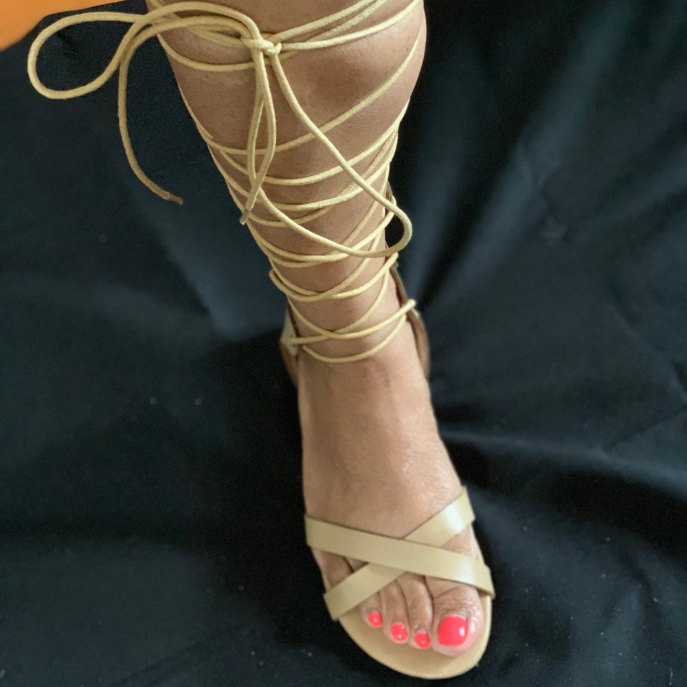 Laced up, opened toe sandals.